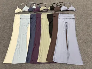 Detailed view of the halter sports bra and folded waist flare yoga pants set in multi colors.