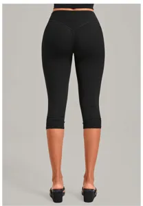 Detail view of black cropped yoga leggings for women, featuring high waist and lifting seams.