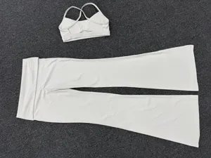 Witte yoga set voor dames met sport-bh en uitlopende broek fitness outfit sportkleding