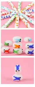 Detailed close-up shot of handmade white glass flat beads featuring colorful goldfish spacers.