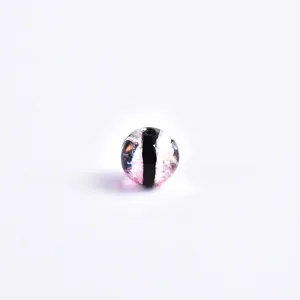 Closeup of luminous starry glass bead with colorful spots, perfect for handmade diy jewelry.