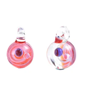 Handmade glass pendant detail, transparent crystal starry sky bead, DIY jewelry accessory close up.