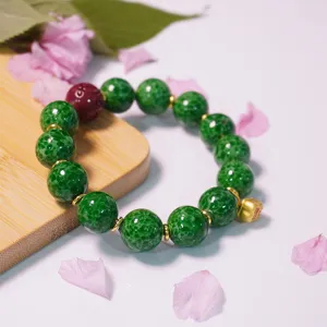 Retro green speckled glass bead bracelet with red accent charm vintage couple jewelry item