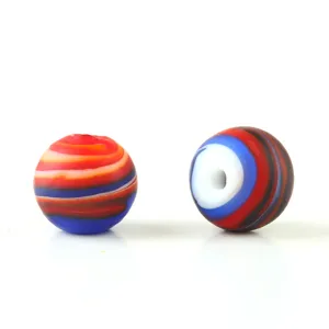 Frosted mixed-color swirl glass bead detail, showing unique red and blue patterns.