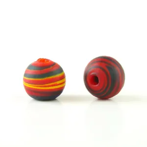 Close-up detail of frosted mixed-color glass beads showing unique swirled texture and hole.