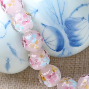 Handmade pink glass flower beads detail close-up, perfect loose beads for DIY jewelry accessories making.