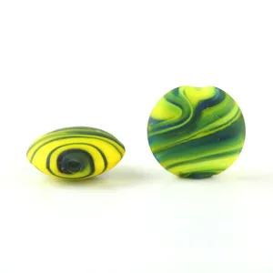 Close-up detail of frosted mixed silk glass beads showing smooth swirl patterns and holes.