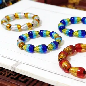 Colorful glass bead bracelet with gradient silver foil, glowing handmade fashion jewelry.