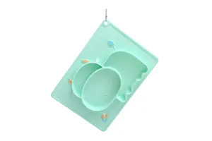 Close-up detail of the hanging mint green silicone divided baby plate, showing fine texture.