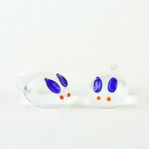 Glass rabbit bead charm with loop, handmade DIY animal jewelry accessory detail shot.