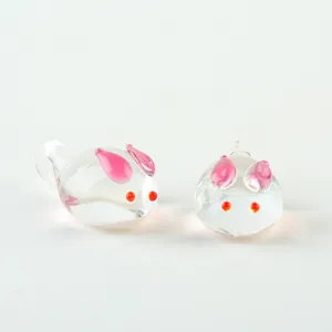Clear glass rabbit bead charm with pink ears and red eyes, perfect for DIY handmade jewelry.