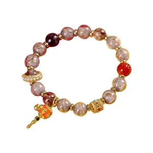 Tibetan cinnabar glazed glass beaded bracelet with exquisite metal charms and pearls for women.