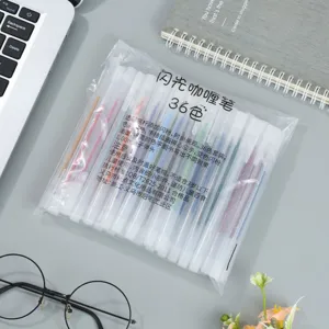 Detailed view of 36-color glitter gel pens set in clear packaging, ideal for writing and art.