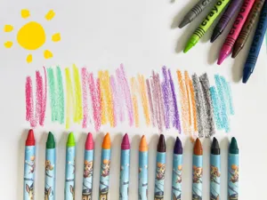Colorful children's crayons set with drawing scribbles and fun cartoon character designs.