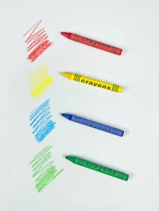 Colorful crayons set with matching color swatches for drawing art painting and school supplies