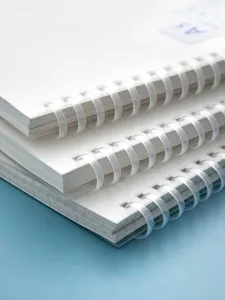 Detail shot of A5 soft silicone spiral notebook with thick paper and clean grid layout design.