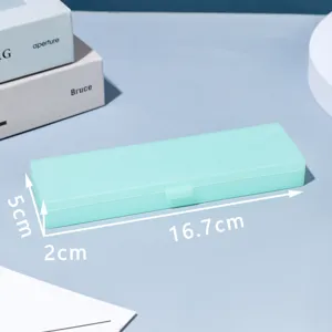Detailed view of the macaron green plastic pencil box showing precise dimensions and clean storage.