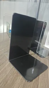 L-shaped black and transparent plastic bookends for desktop book storage and organization.