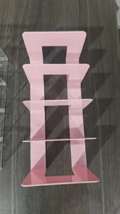 Pink acrylic 4-tier bookend desktop organizer for books and files, stylish desk decor.