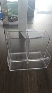 Clear transparent plastic desktop organizer and bookend for office and home desk storage.