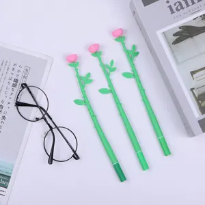 Detail shot of creative rose flower gel pens with green stem and pink floral top, stationery