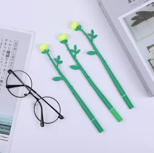 Close-up detail shot of creative rose flower gel pens with green stem design for writing stationery.