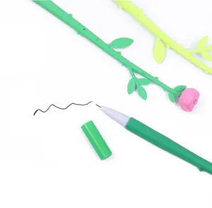 Detailed view of rose flower gel pen with green stem design and black ink test line.