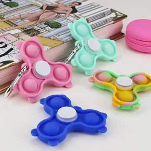 Colorful silicone push pop bubble fidget spinner toy with metal keychain for stress relief.