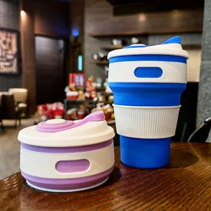 Portable collapsible silicone coffee cup telescopic travel mug with lid for outdoor use.