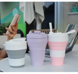 Detail view of portable silicone folding travel coffee cups with straw for outdoor sports.