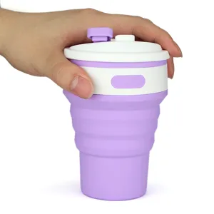 Detailed shot of portable collapsible silicone travel cup in purple, compact and flexible design.