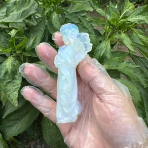 Close-up detail of a 10cm opal crystal angel figurine, beautiful carving for decoration.