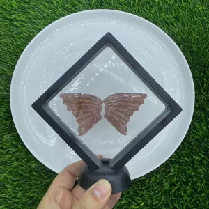 Natural gemstone crystal butterfly wings specimen in floating display frame, detailed crystal art.