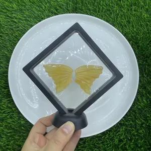 Close-up view of natural yellow crystal butterfly wings in frame. Detailed crystal texture.