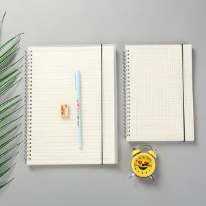 Carnet à spirale translucide mat avec bande élastique, pages lignées et quadrillées pour bureau.
