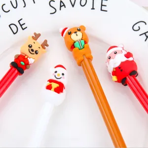 Closeup of cute Christmas cartoon gel pens featuring reindeer, bear, snowman, and Santa designs.