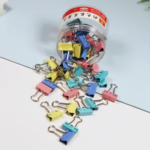 Colorful 19mm binder clips in clear jar, perfect for office organizing and stationery use.