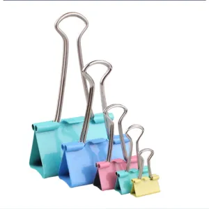 Close-up detail shot of colorful metal binder clips in a neat progressive size lineup.