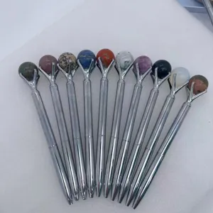 Crystal sphere ballpoint pens with natural stone balls, metal body, multi-color variant set display.