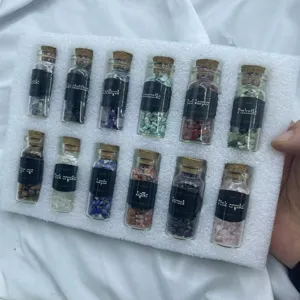Detailed view of 12 natural crystal chips in glass wishing bottles with clear black label text.