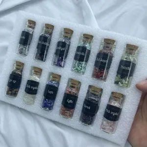 Detail shot of 12 natural crystal chip bottles in foam box, mineral specimen collection.