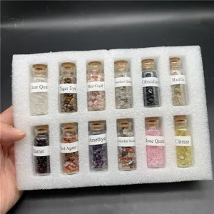 Detail shot of 12 crystal chip bottles set, miniature mineral specimens with glass and cork.