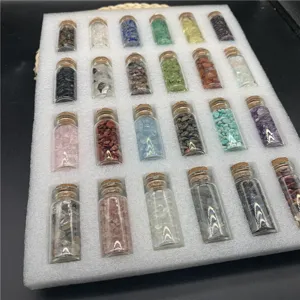 Natural crystal chips wishing bottles set, assorted gemstone glass jars for healing decor.