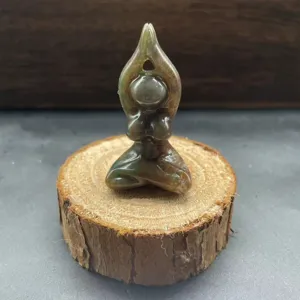 Detailed view of natural stone yoga woman carving, exquisite crystal sculpture craft.