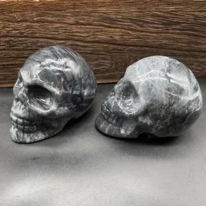 Natural stone carved skull ornament, 7cm black flash grid crystal skull healing decor.