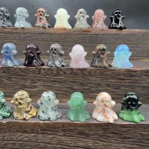 Detail view of miniature crystal ghost carvings, various gemstone materials displayed closely.