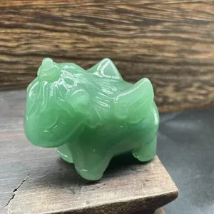Green aventurine crystal carved animal figurine, smooth polished surface showing fine details.