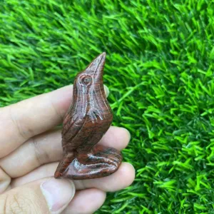 Close-up of a 5cm natural gemstone carved raven bird crystal figurine, exquisite detail.