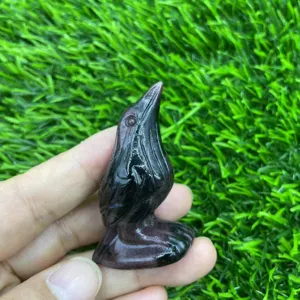 Detail view of a 5cm hand-carved crystal raven bird figurine, perfect for healing crystal decor.