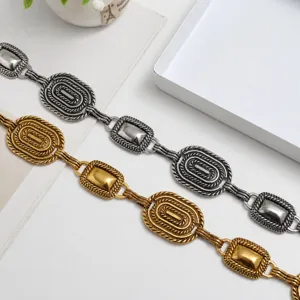 Vintage metal waist chain belt for women, retro carved chain link dress accessory.
